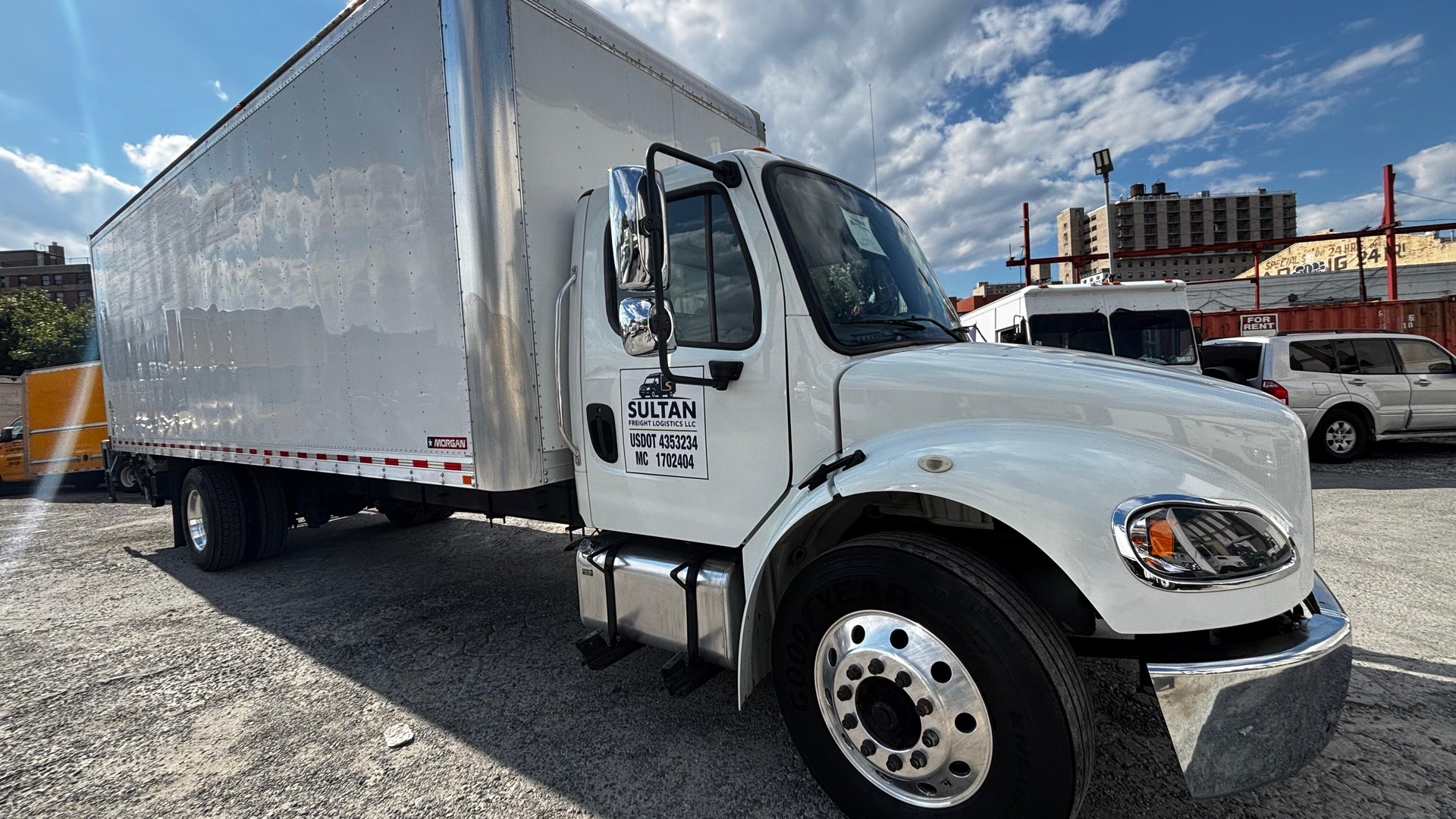 Sultan Freight branding close-up on truck door